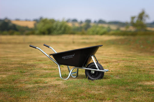 Carrimore Muckmaster 160L wheelbarrow outdoors; pneumatic wheel shown