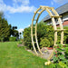 Jagram Moongate Double Standard circular timber garden arch beside a garden path