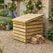 Zest 355 litre wooden Garden Storage Chest beside a garden wall